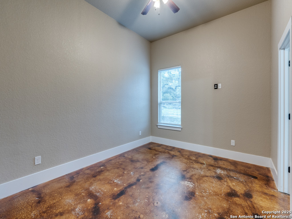 629 Windmill Ranch Road Spring Branch, TX 78070 - Photo 27 of 34 a view of an empty room with a window