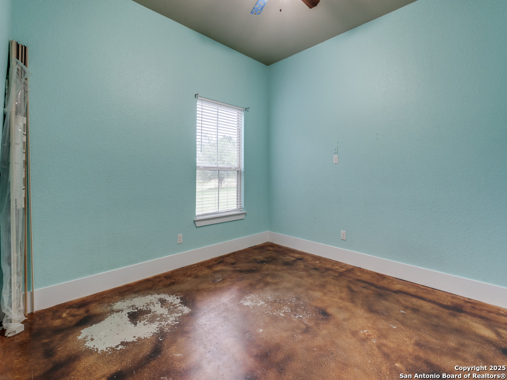 629 Windmill Ranch Road Spring Branch, TX 78070 - Photo 29 of 34 an empty room with windows