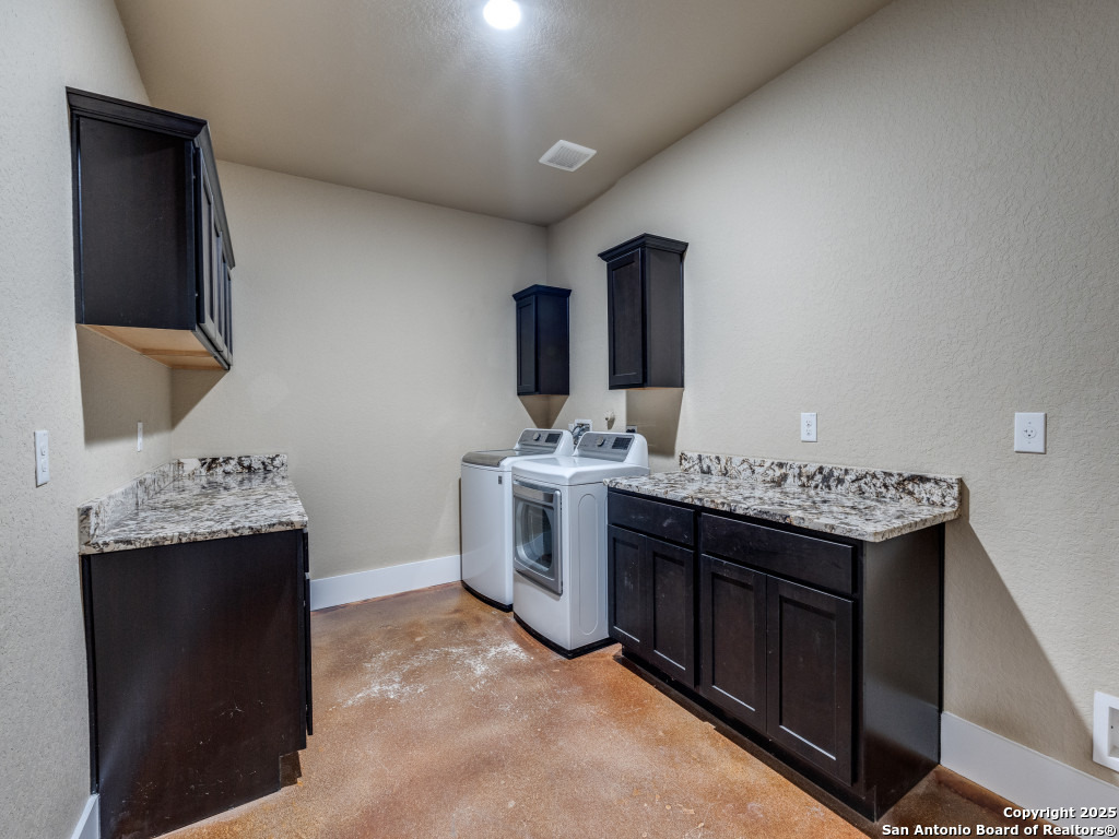 629 Windmill Ranch Road Spring Branch, TX 78070 - Photo 31 of 34 a kitchen with a sink cabinets and appliances