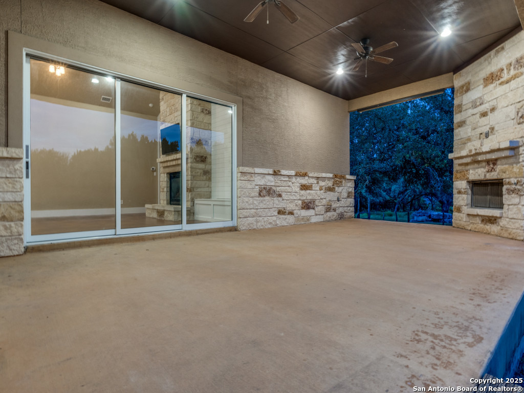 629 Windmill Ranch Road Spring Branch, TX 78070 - Photo 32 of 34 a view of an empty room with a fireplace