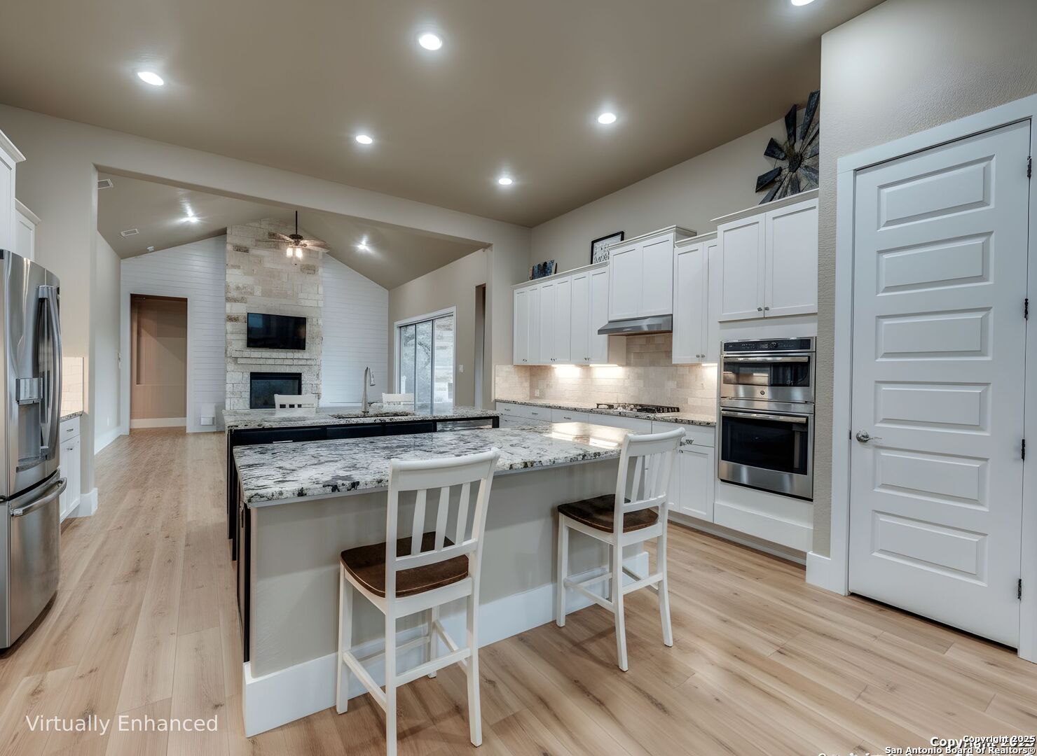 629 Windmill Ranch Road Spring Branch, TX 78070 - Photo 7 of 34 a kitchen with stainless steel appliances granite countertop a stove and a refrigerator