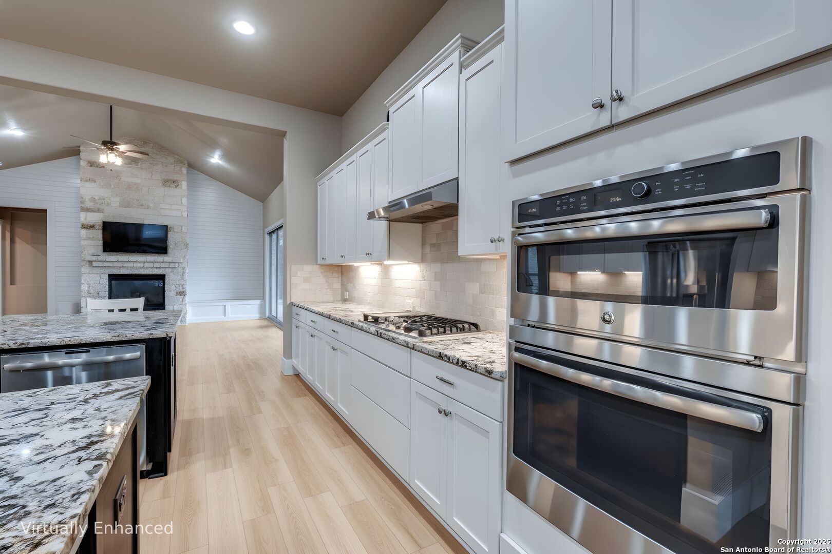 629 Windmill Ranch Road Spring Branch, TX 78070 - Photo 9 of 34 a kitchen with stainless steel appliances kitchen island granite countertop a stove and a sink