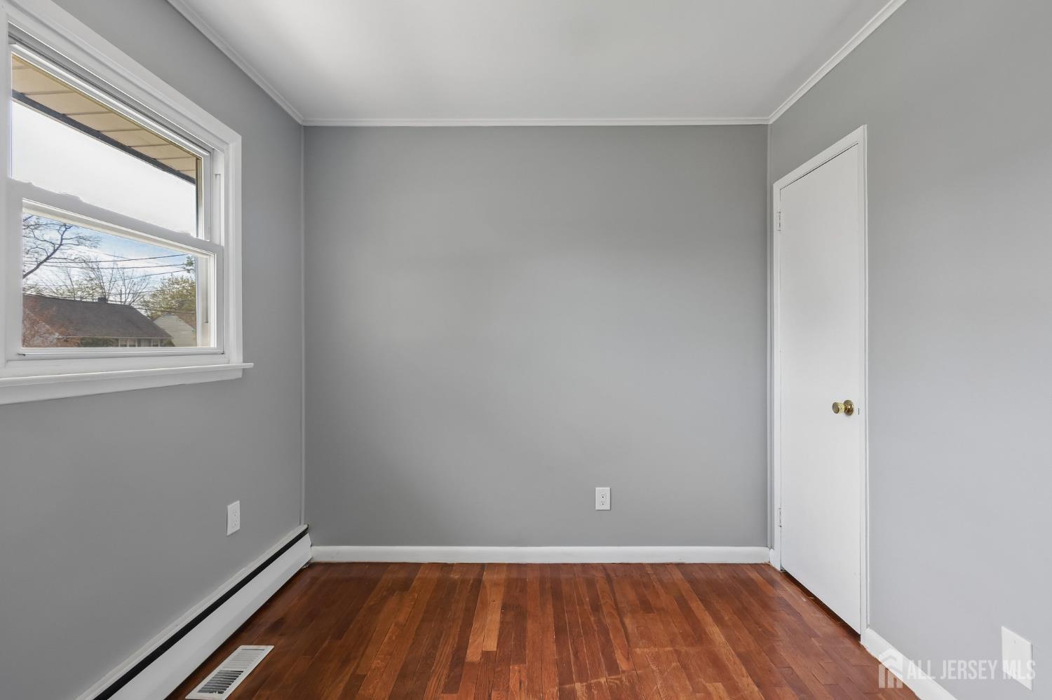 2 Westbury Road Iselin, NJ 08830 - Photo 11 of 25 a view of a room with wooden floor and window