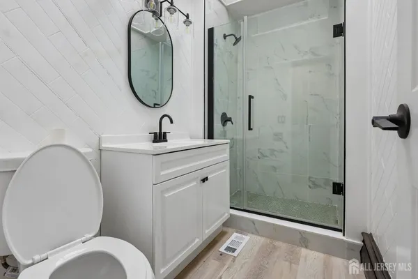 a bathroom with a toilet sink and shower