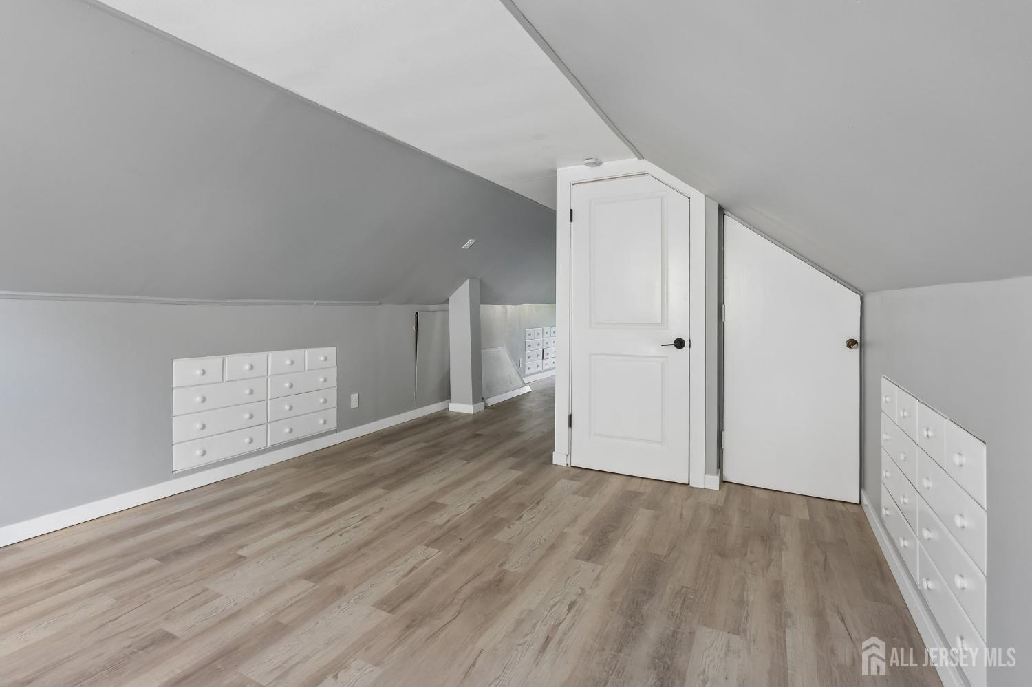 2 Westbury Road Iselin, NJ 08830 - Photo 16 of 25 a view of an empty room with wooden floor