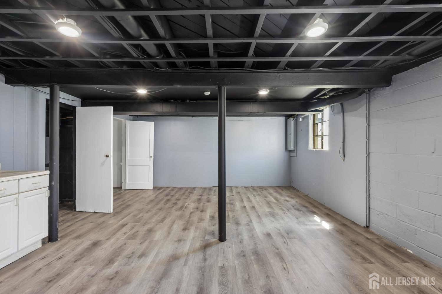 2 Westbury Road Iselin, NJ 08830 - Photo 24 of 25 a view of an empty room with wooden floor