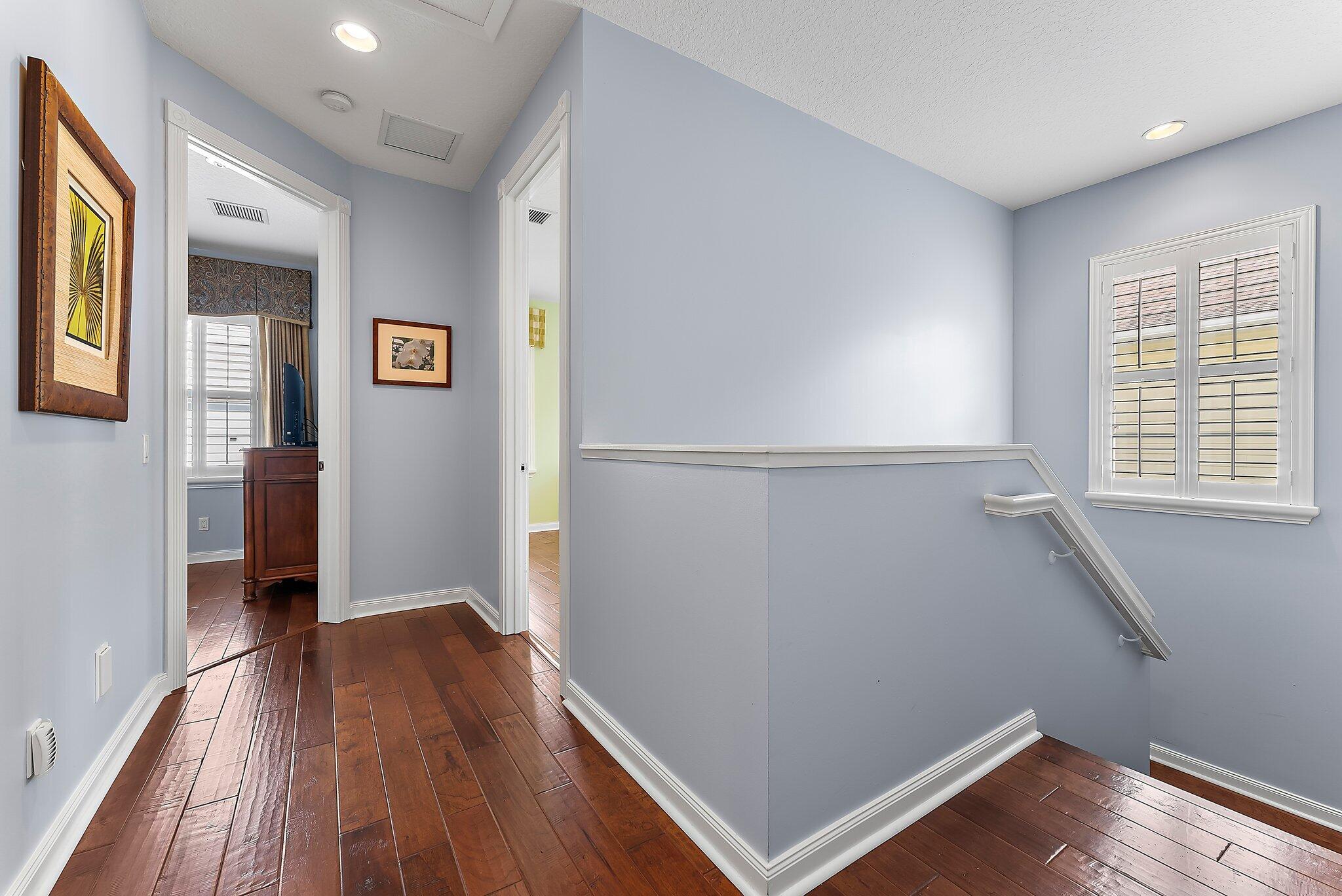 115 Castries Drive Jupiter, FL 33458 - Photo 24 of 60 wooden floor in an empty room with a window