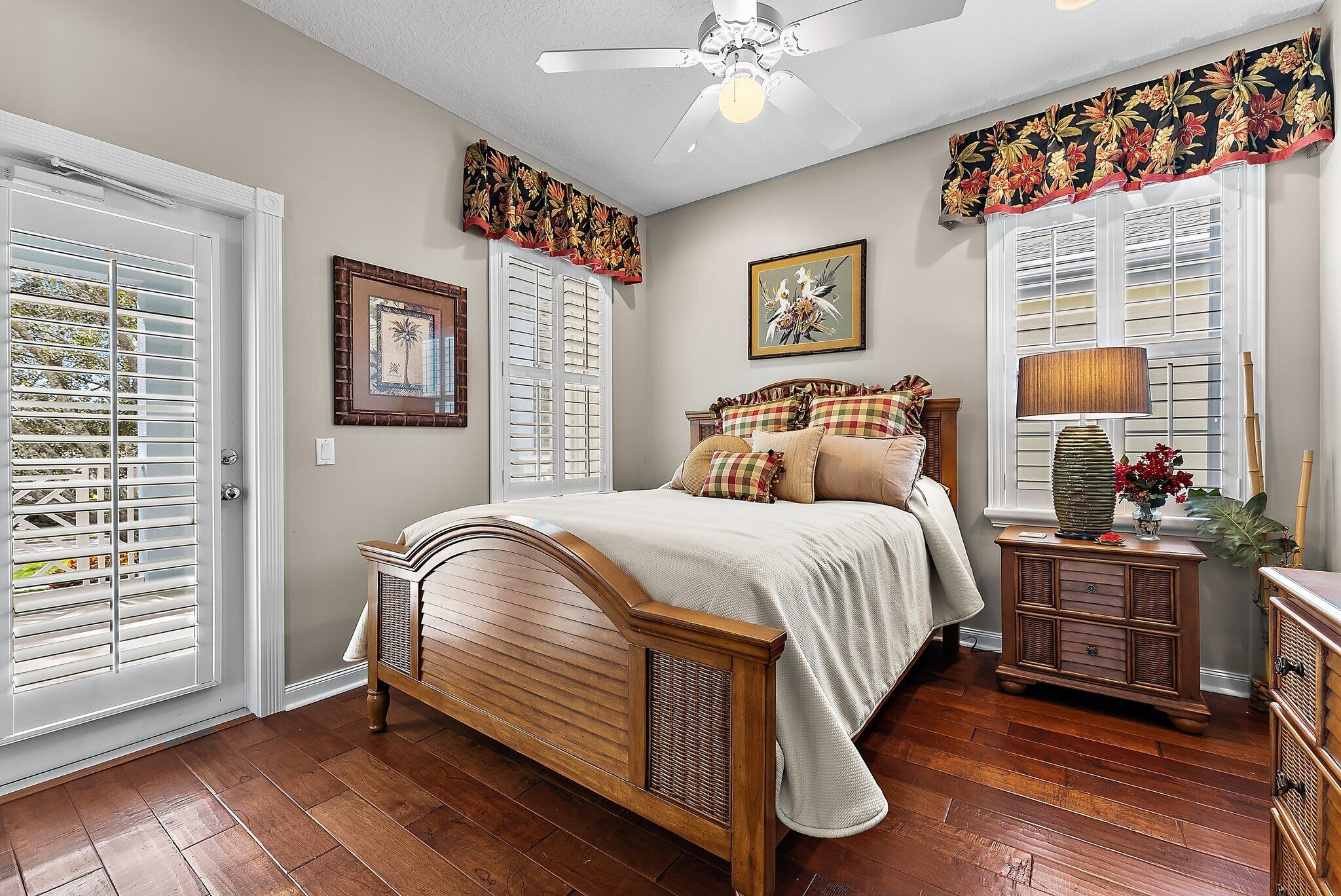 115 Castries Drive Jupiter, FL 33458 - Photo 34 of 60 a bedroom with a bed and wooden floor