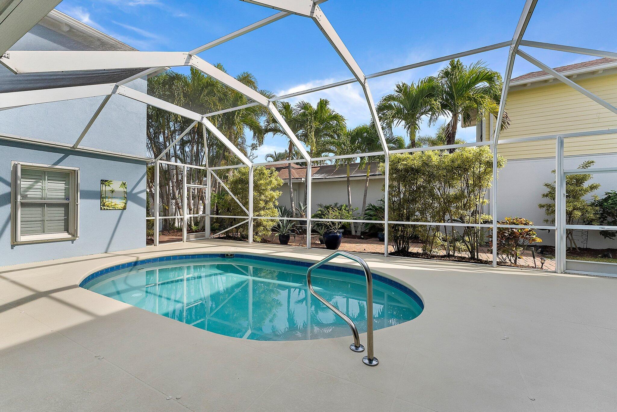 115 Castries Drive Jupiter, FL 33458 - Photo 44 of 60 a view of a swimming pool with a patio
