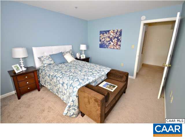 200 Lake Club Court, Unit 3 Charlottesville, VA 22902 - Photo 10 of 16 a bedroom with a bed and a night stand