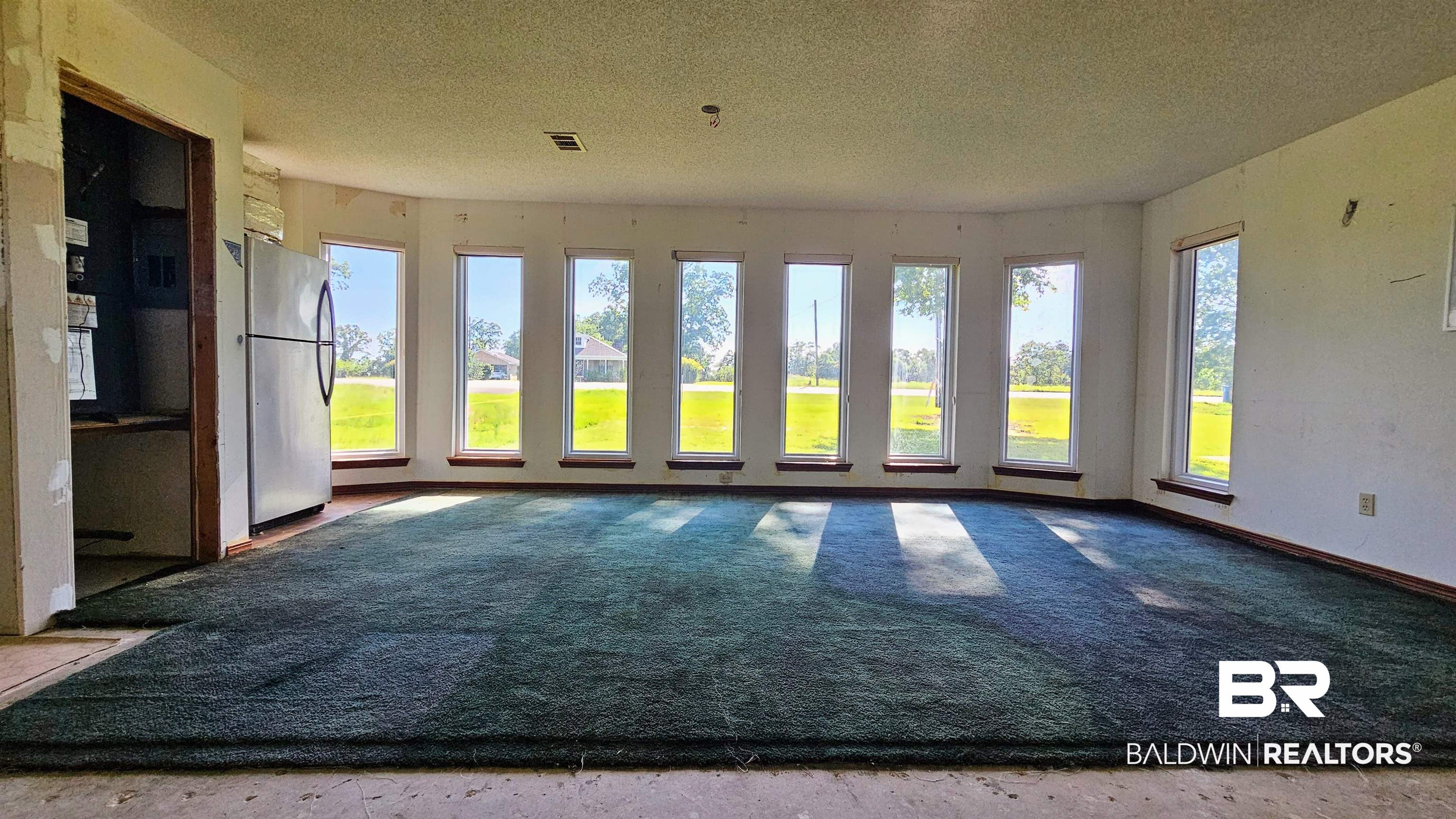 18824 Highway 41 Brewton, AL 36426 - Photo 21 of 40 Expansive interior space featuring a wall of multiple windows, providing abundant natural illumination