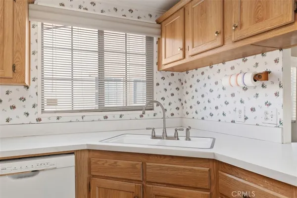 a bathroom with a sink and a window
