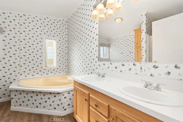 a bathroom with a bathtub and a sink