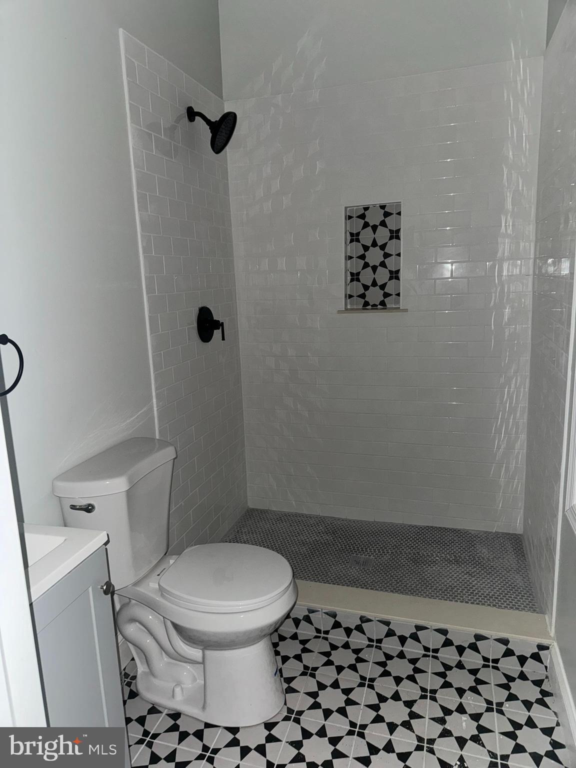 3218 Frederick Avenue Baltimore, MD 21229 - Photo 12 of 32 a bathroom with a toilet and a shower