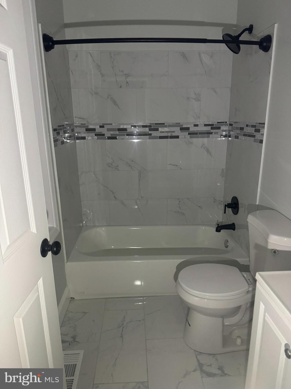 3218 Frederick Avenue Baltimore, MD 21229 - Photo 15 of 32 a white toilet sitting next to a bath tub