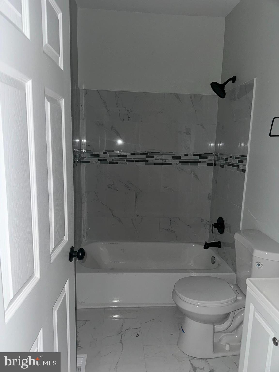 3218 Frederick Avenue Baltimore, MD 21229 - Photo 16 of 32 a bathroom with a toilet and a shower
