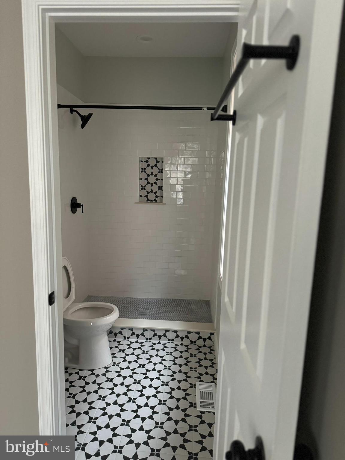 3218 Frederick Avenue Baltimore, MD 21229 - Photo 18 of 32 a bathroom with a toilet and a shower