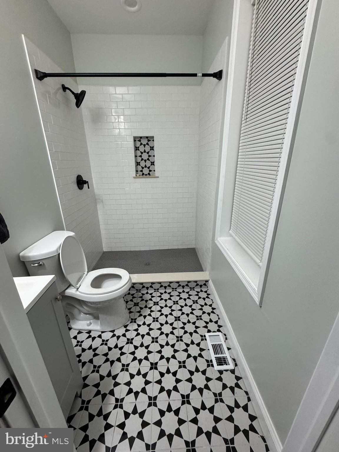3218 Frederick Avenue Baltimore, MD 21229 - Photo 21 of 32 a bathroom with a toilet and a shower