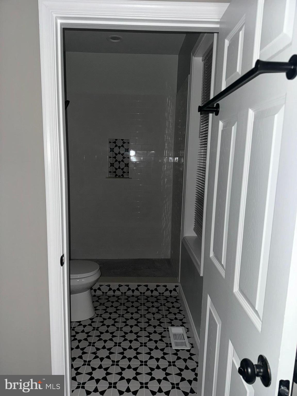 3218 Frederick Avenue Baltimore, MD 21229 - Photo 28 of 32 a bathroom with a sink and a shower