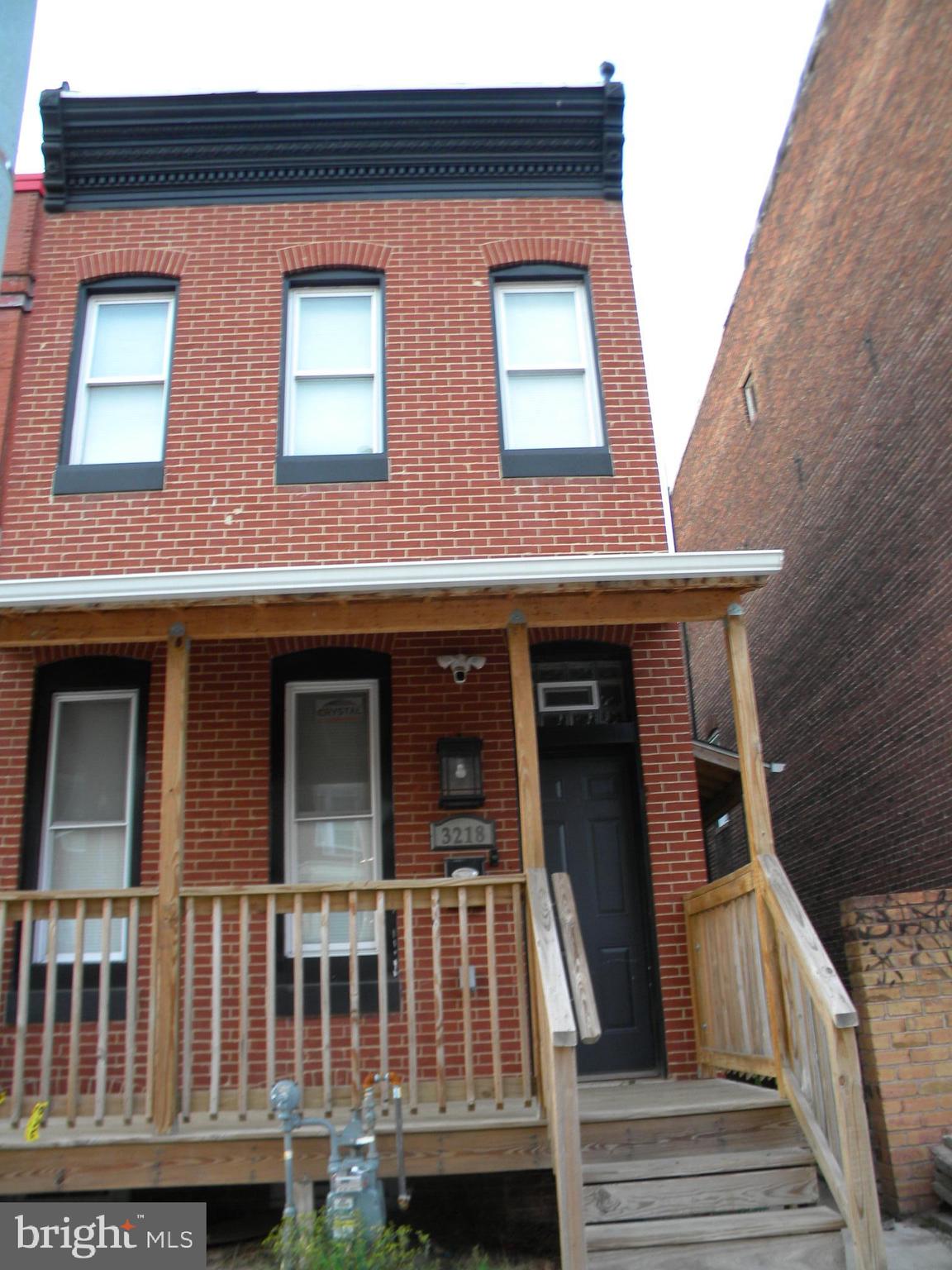 3218 Frederick Avenue Baltimore, MD 21229 - Photo 3 of 32 a front view of a house