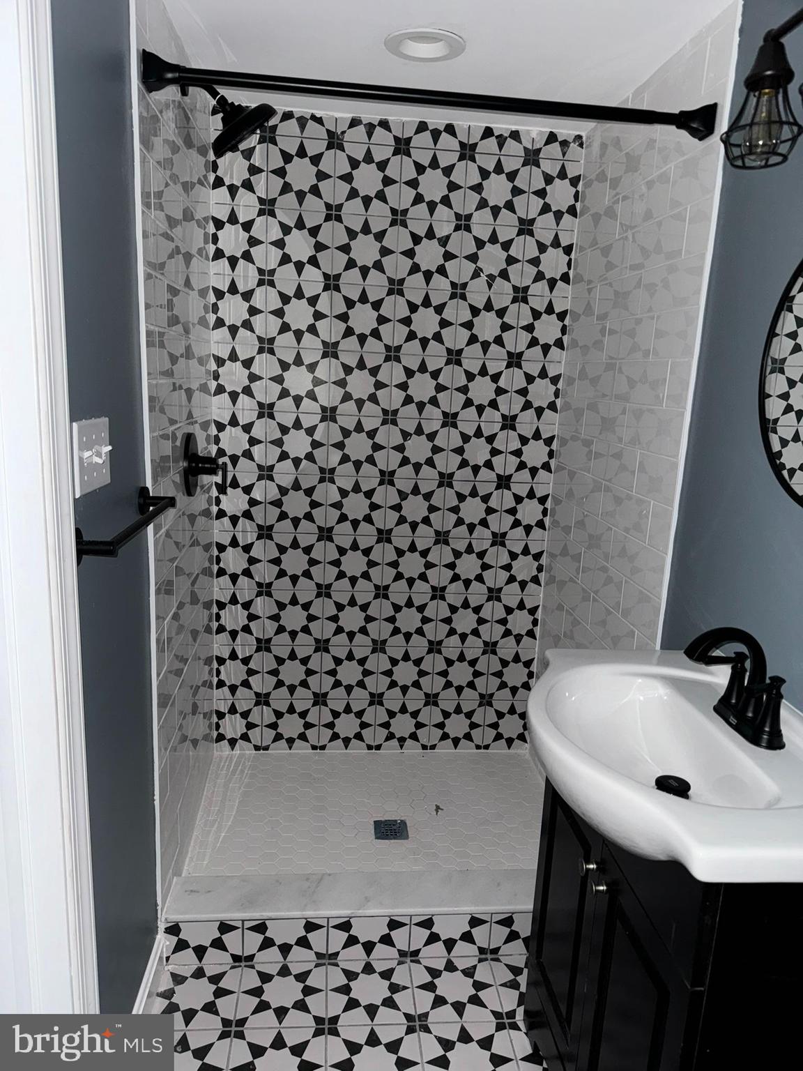 3218 Frederick Avenue Baltimore, MD 21229 - Photo 10 of 32 a bathroom with a sink and a shower