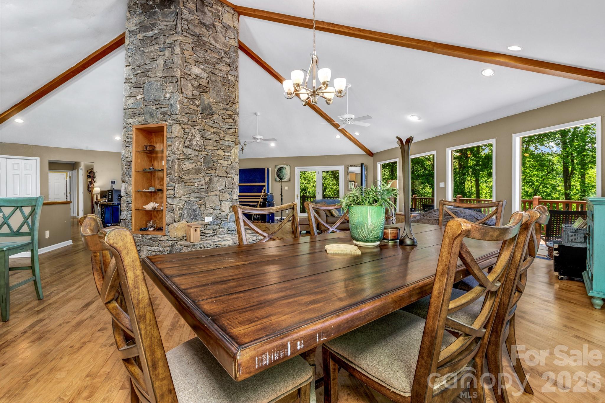125 Winding Ridge Road Asheville, NC 28803 - Photo 14 of 48 a dining room with furniture a chandelier and wooden floor