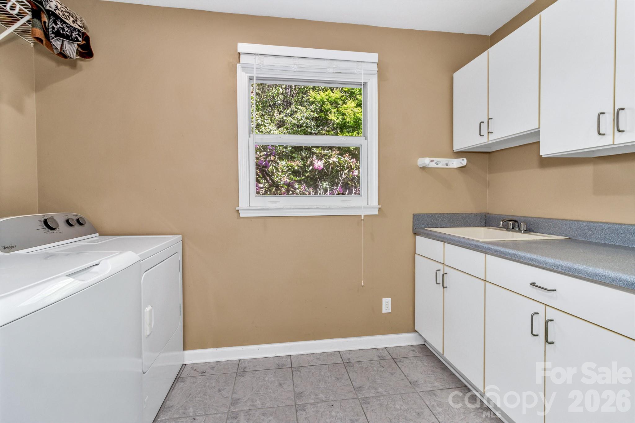 125 Winding Ridge Road Asheville, NC 28803 - Photo 15 of 48 a utility room with cabinets washer and dryer