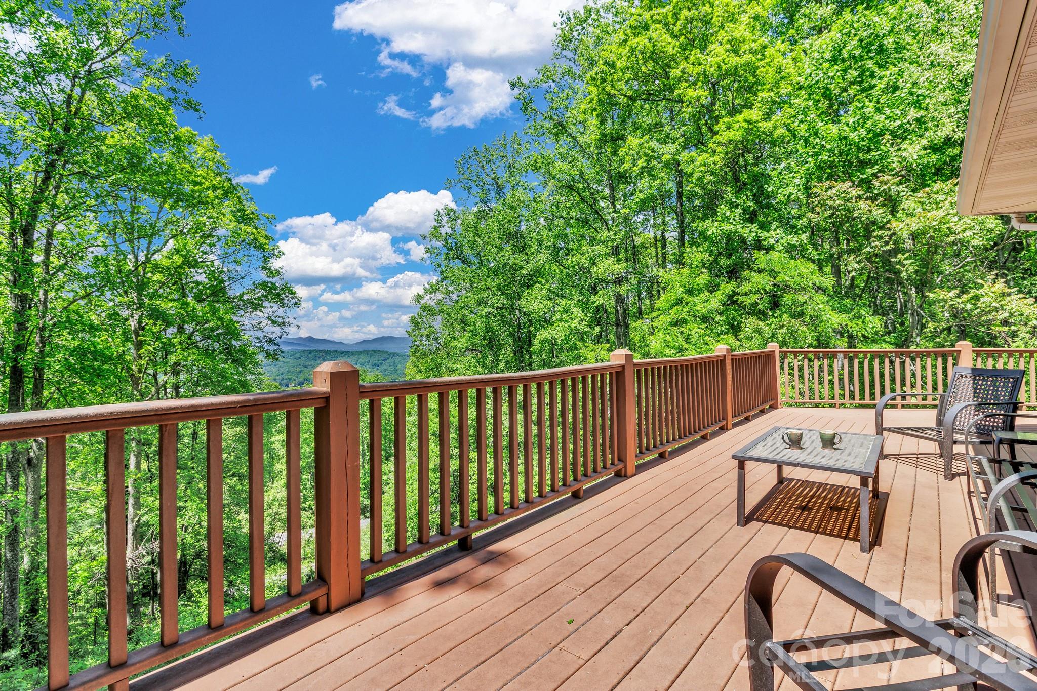 125 Winding Ridge Road Asheville, NC 28803 - Photo 17 of 48 a balcony with wooden floor and fence