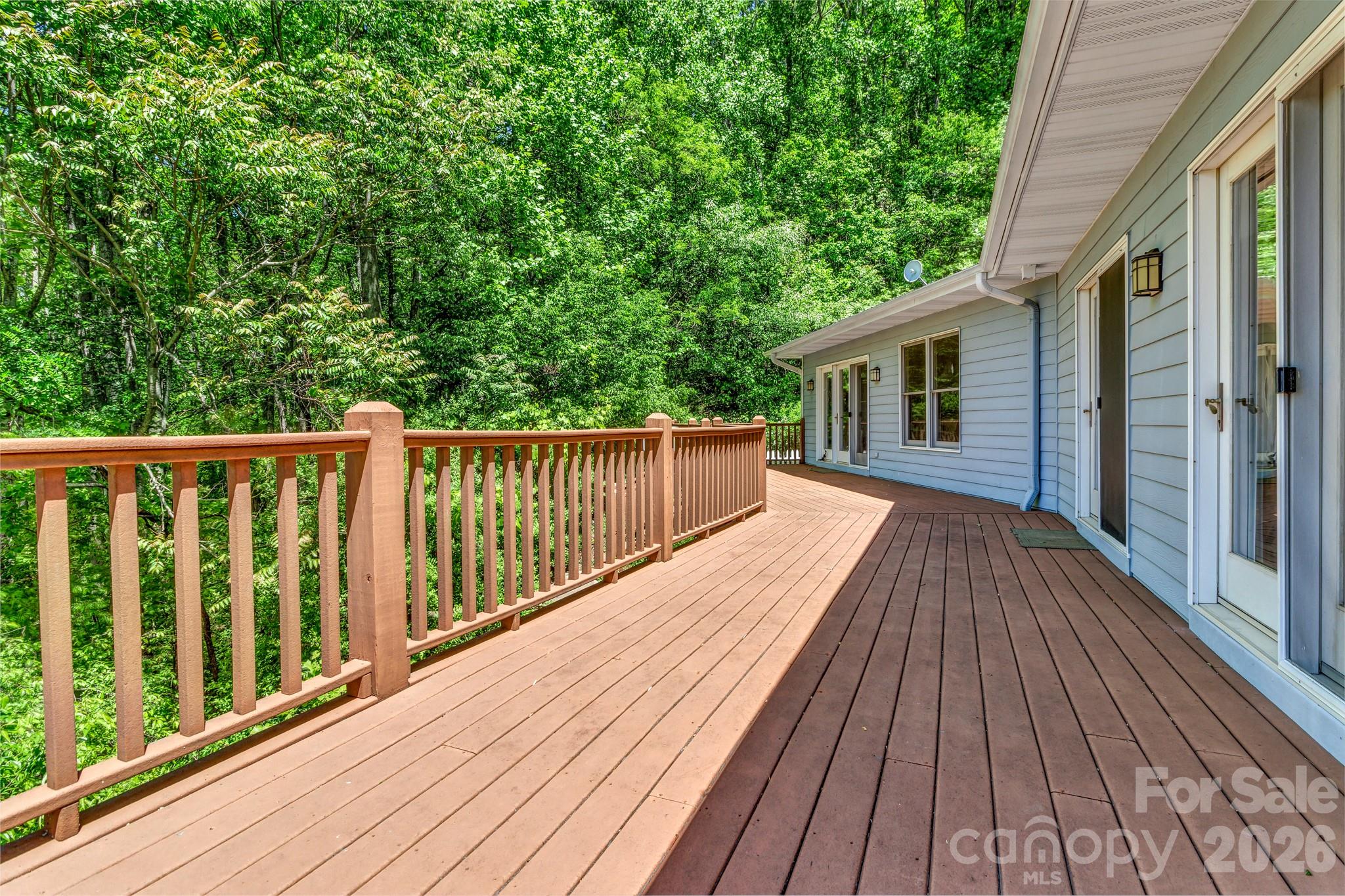 125 Winding Ridge Road Asheville, NC 28803 - Photo 18 of 48 a balcony with wooden floor and fence