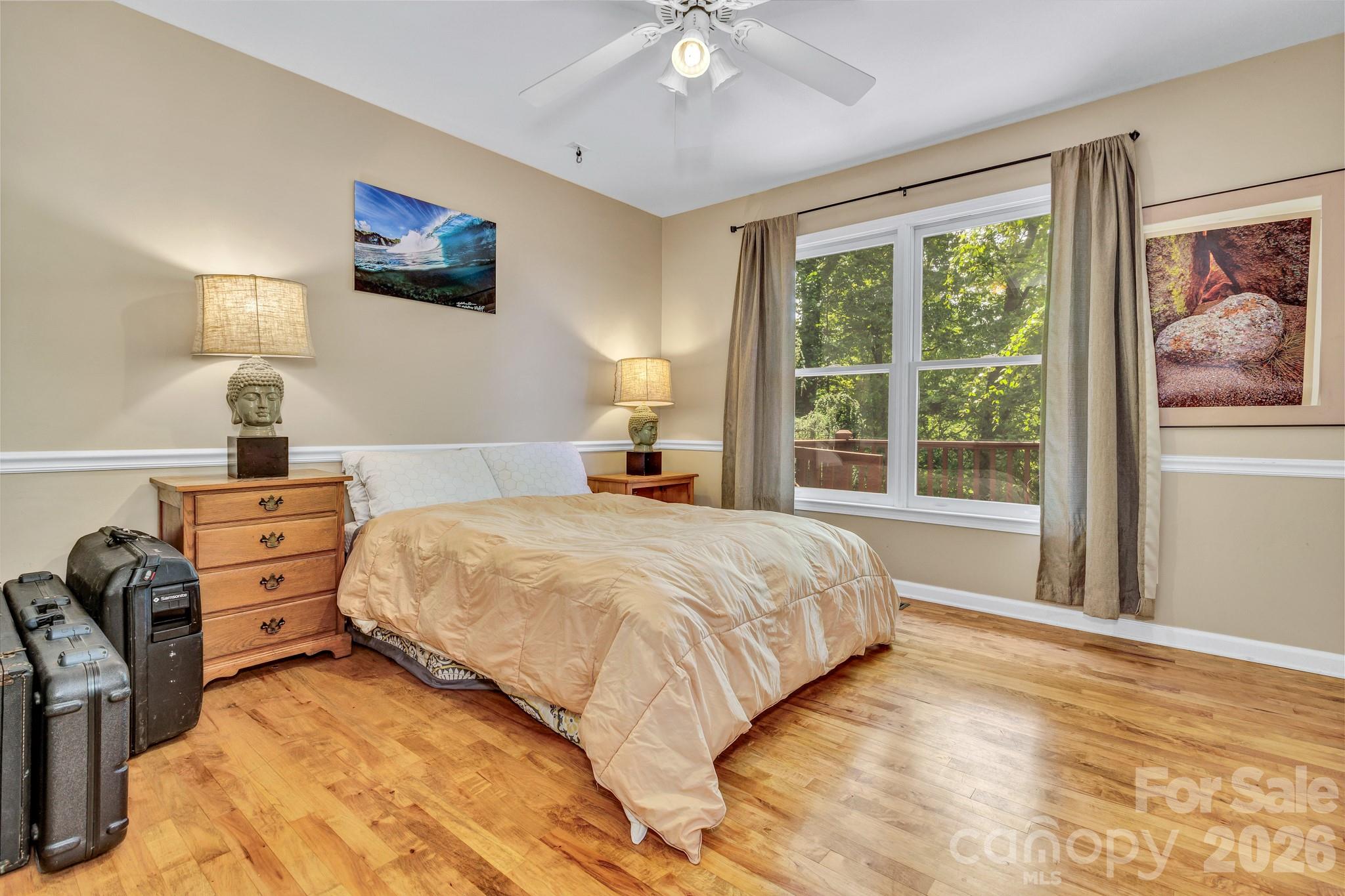 125 Winding Ridge Road Asheville, NC 28803 - Photo 27 of 48 a bedroom with a bed and a large window