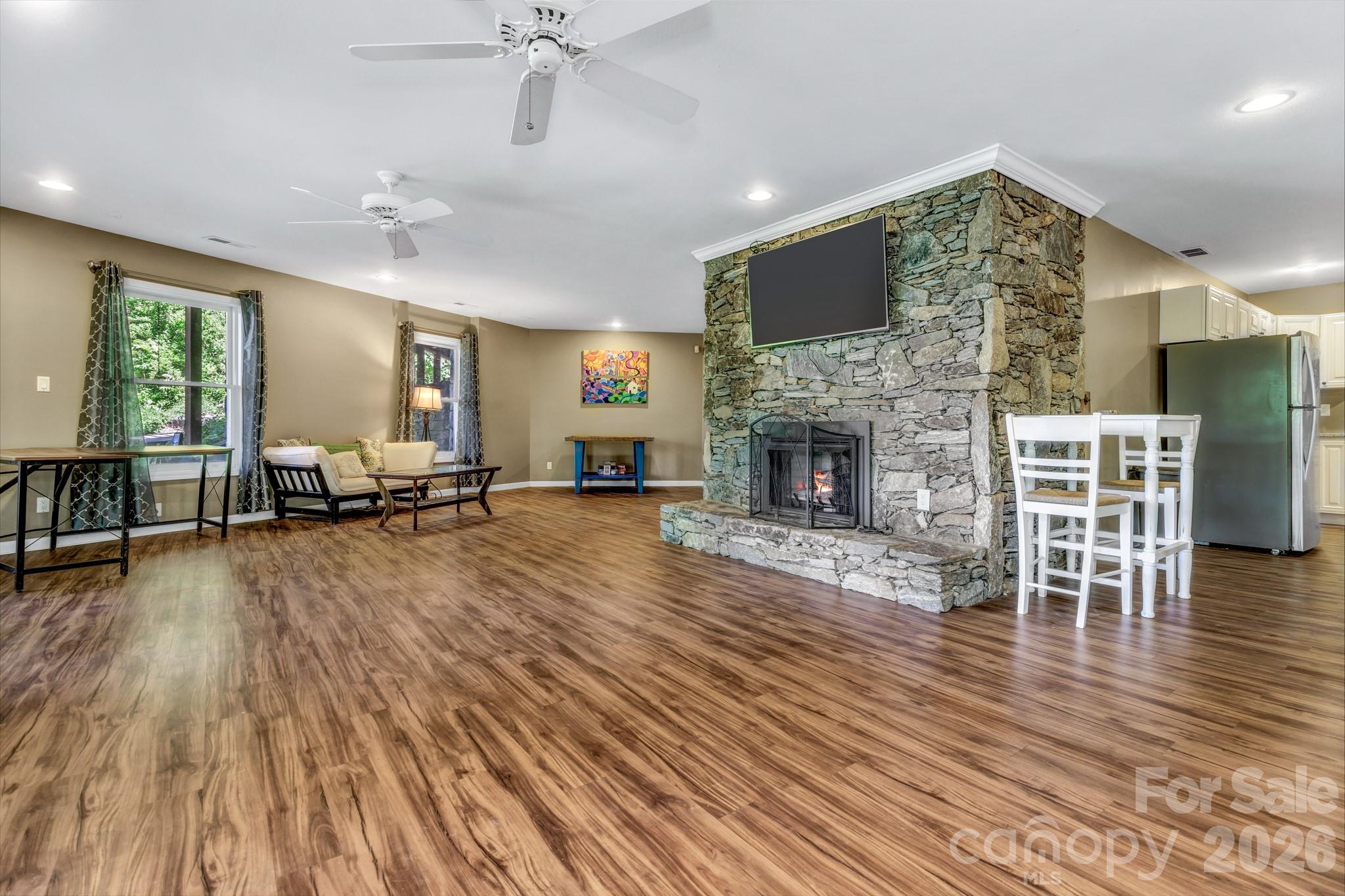 125 Winding Ridge Road Asheville, NC 28803 - Photo 29 of 48 a view of a livingroom with furniture hardwood floor and a fireplace