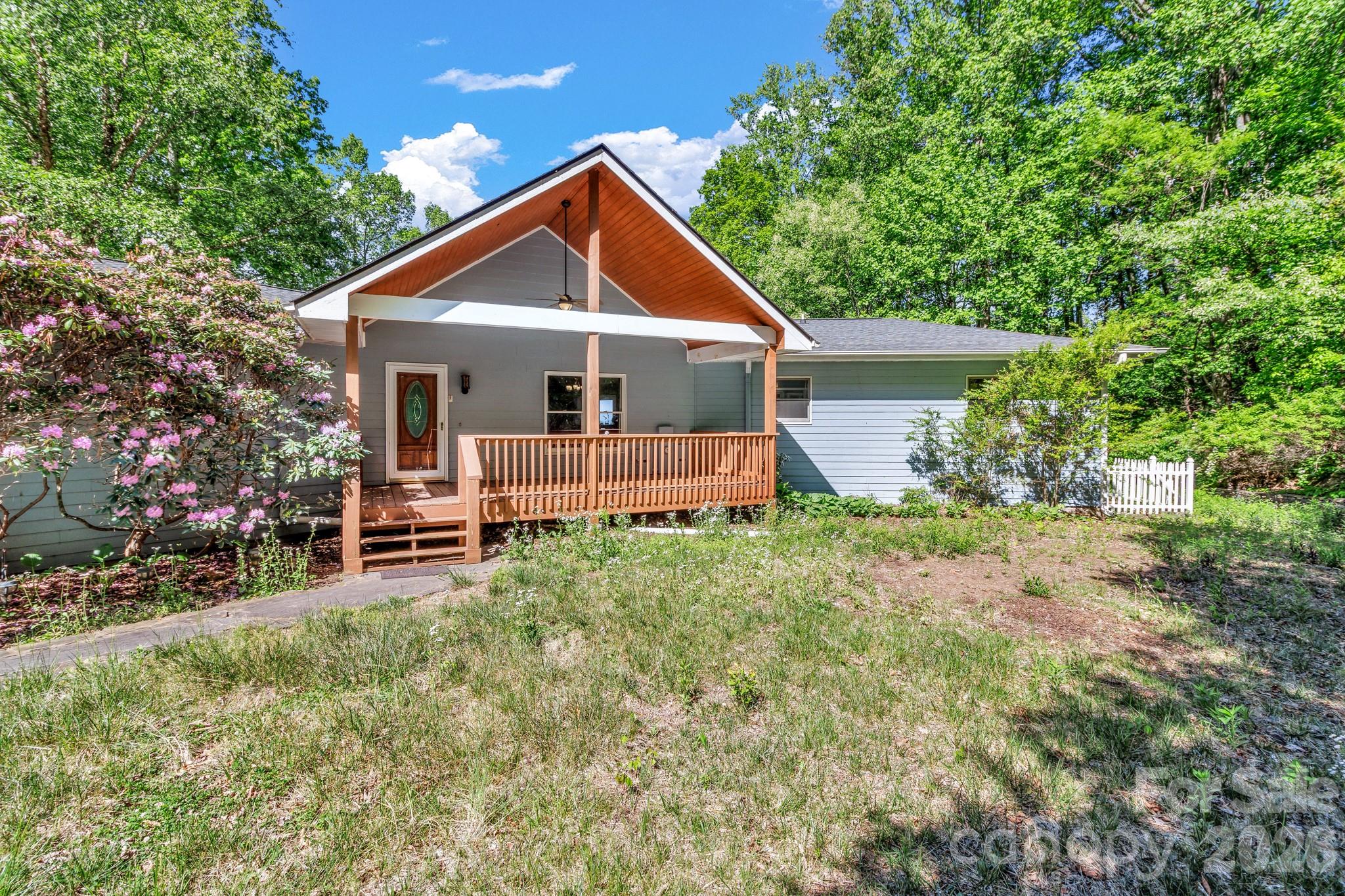 125 Winding Ridge Road Asheville, NC 28803 - Photo 3 of 48 a front view of a house with garden