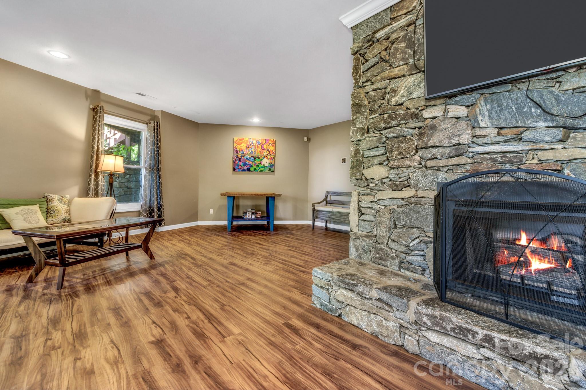 125 Winding Ridge Road Asheville, NC 28803 - Photo 31 of 48 a living room with furniture and a fireplace