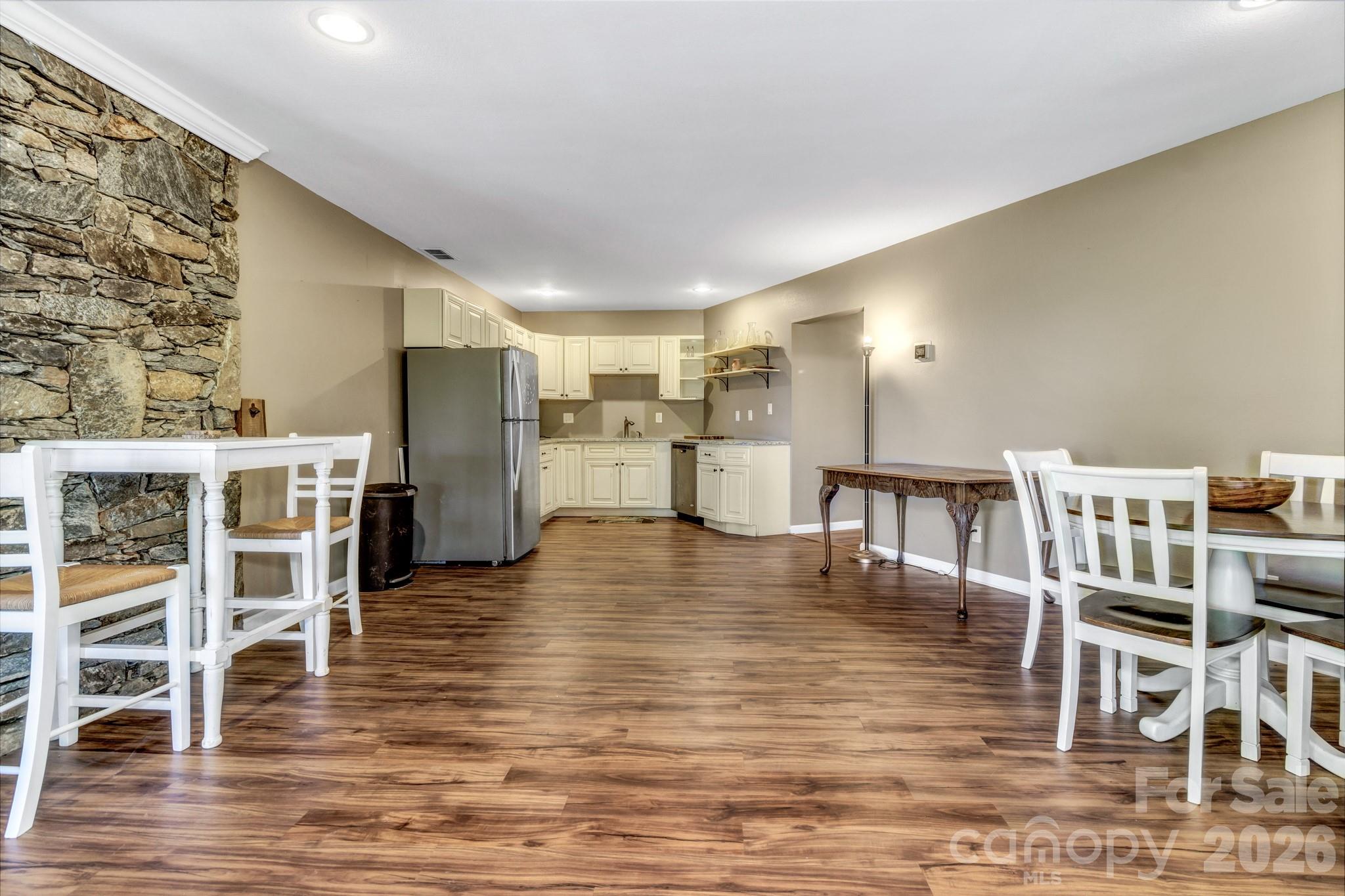 125 Winding Ridge Road Asheville, NC 28803 - Photo 32 of 48 a view of a kitchen with dining table and chairs