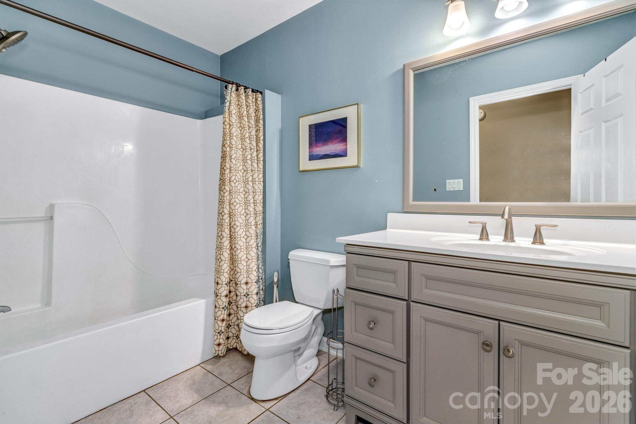 125 Winding Ridge Road Asheville, NC 28803 - Photo 37 of 48 a bathroom with a sink toilet and shower