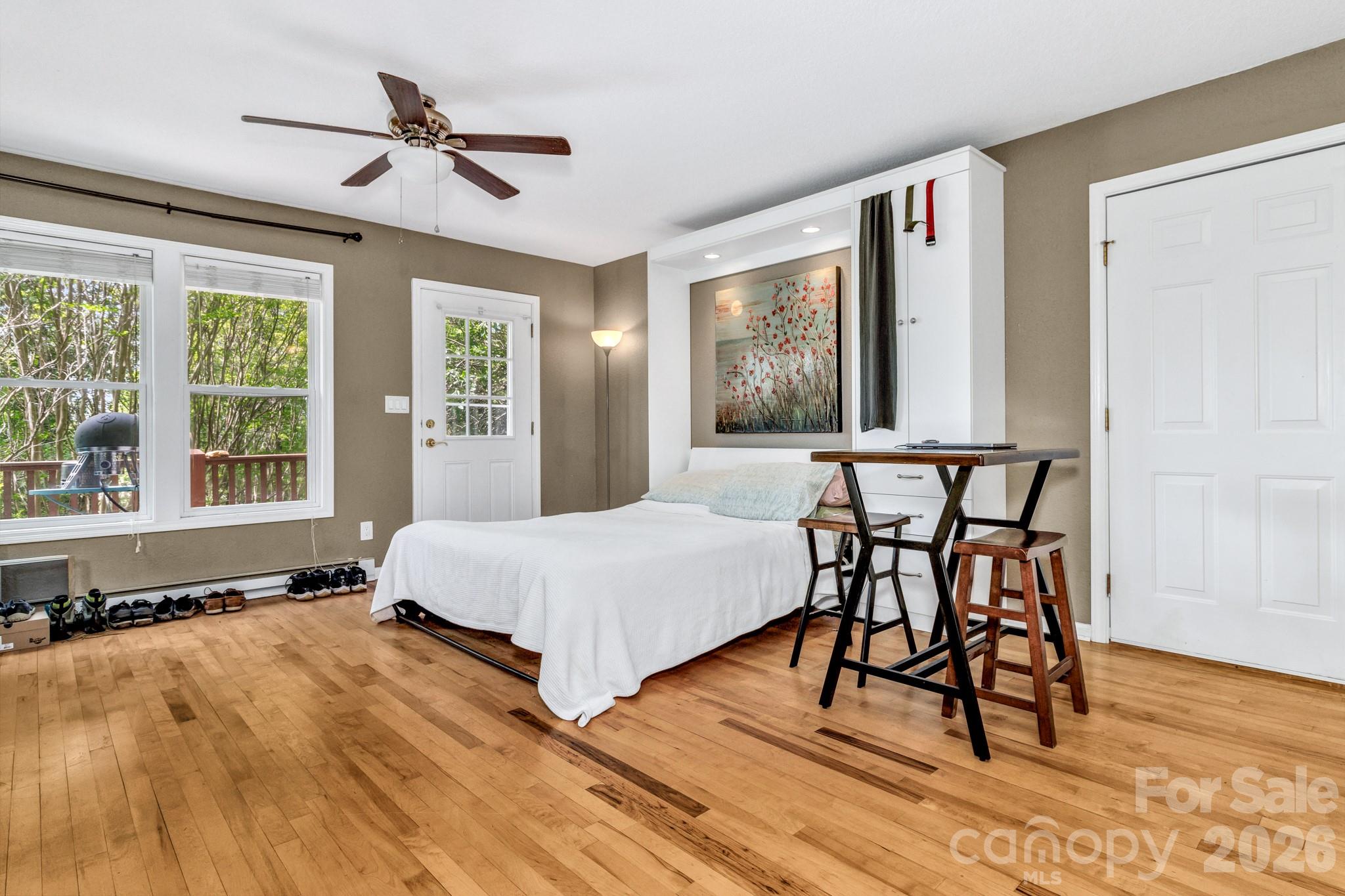 125 Winding Ridge Road Asheville, NC 28803 - Photo 45 of 48 a bedroom with a bed and a large window
