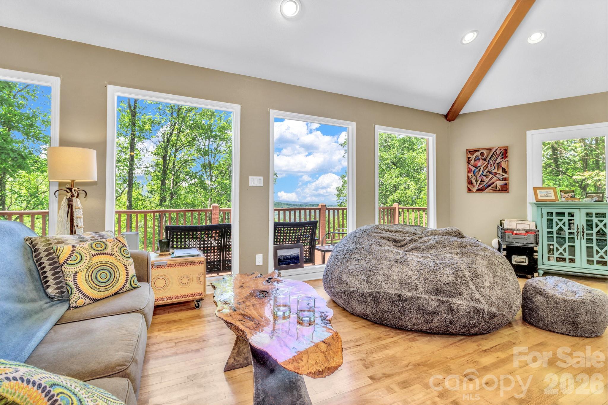 125 Winding Ridge Road Asheville, NC 28803 - Photo 6 of 48 a living room with furniture and a fireplace