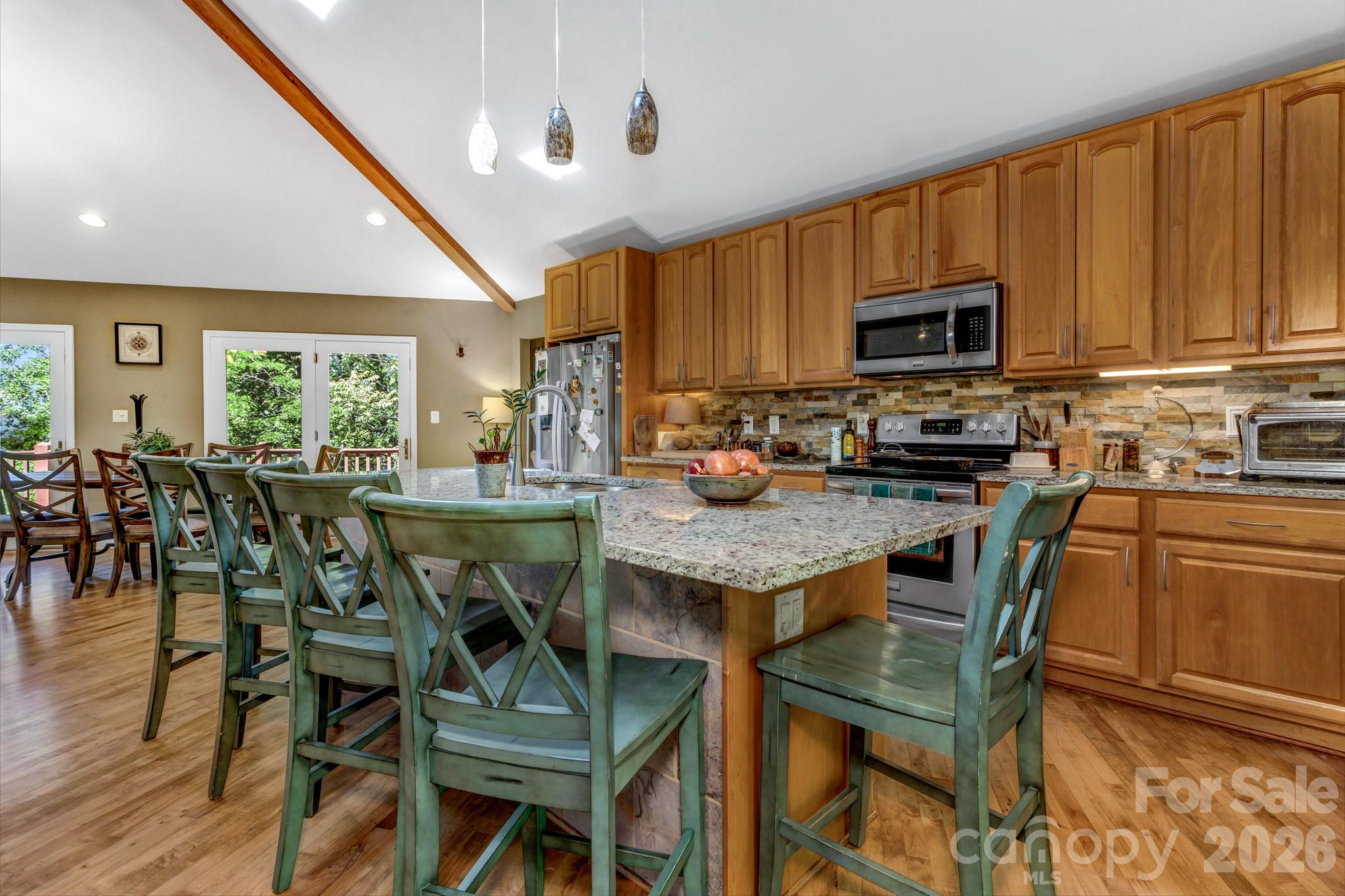 125 Winding Ridge Road Asheville, NC 28803 - Photo 10 of 48 a view of a dining room with furniture and wooden floor