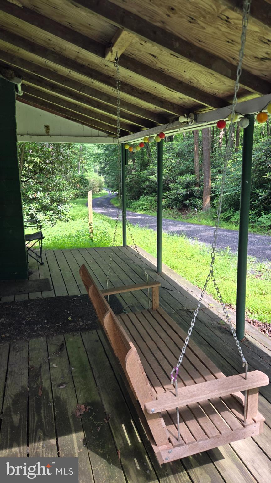 212 Thickhead Mountain Road Centre Hall, PA 16828 - Photo 27 of 28 Charming front porch swing in a serene setting.