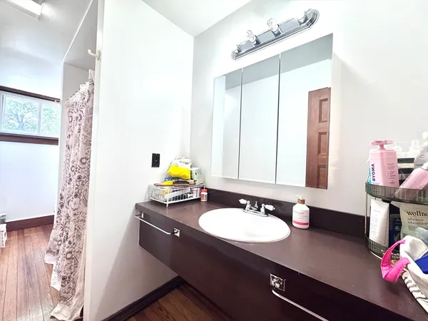 a bathroom with a sink double vanity and a mirror