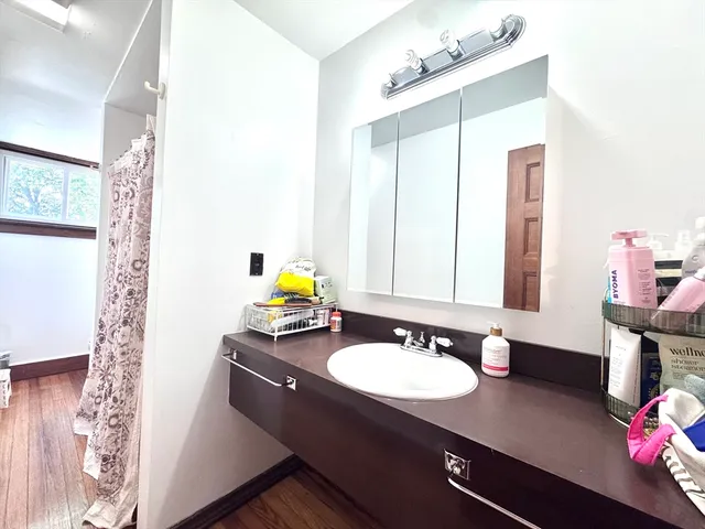 a bathroom with a sink double vanity and a mirror