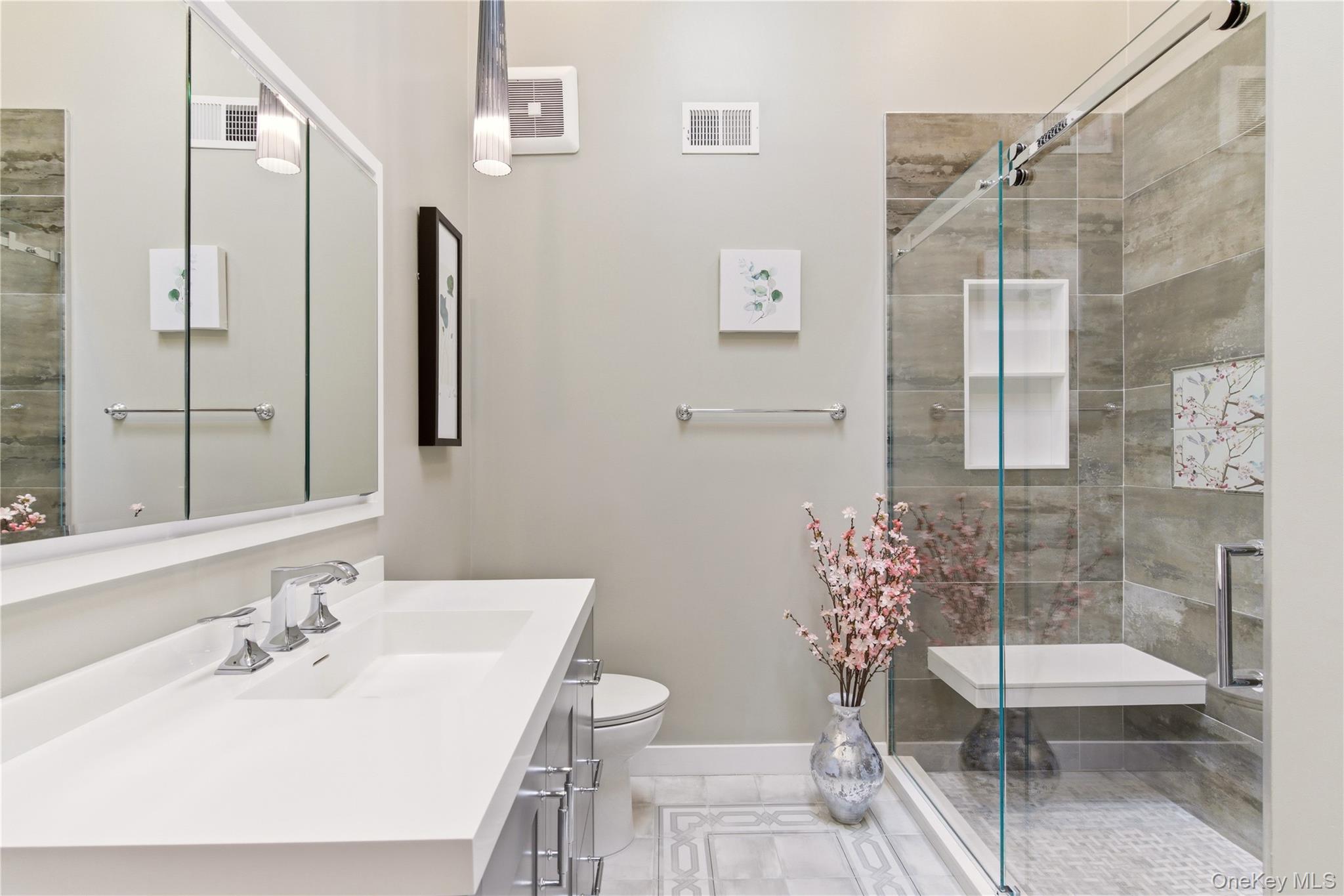 44 Hidden Ridge Drive Syosset, NY 11791 - Photo 13 of 28 a bathroom with a sink toilet and shower