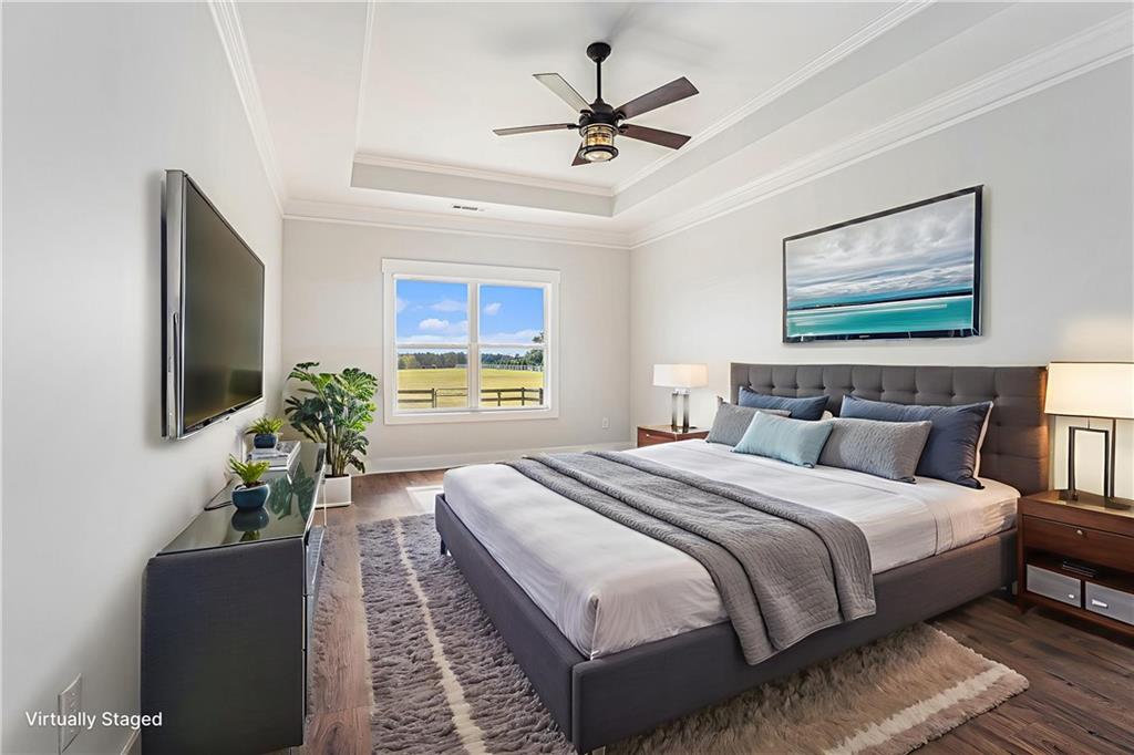 1550 Knox Chapel Road Social Circle, GA 30025 - Photo 20 of 35 a bedroom with bed windows and a flat screen tv