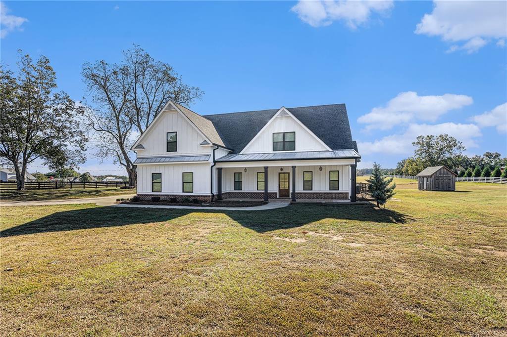 1550 Knox Chapel Road Social Circle, GA 30025 - Photo 2 of 35 a front view of a house with swimming pool