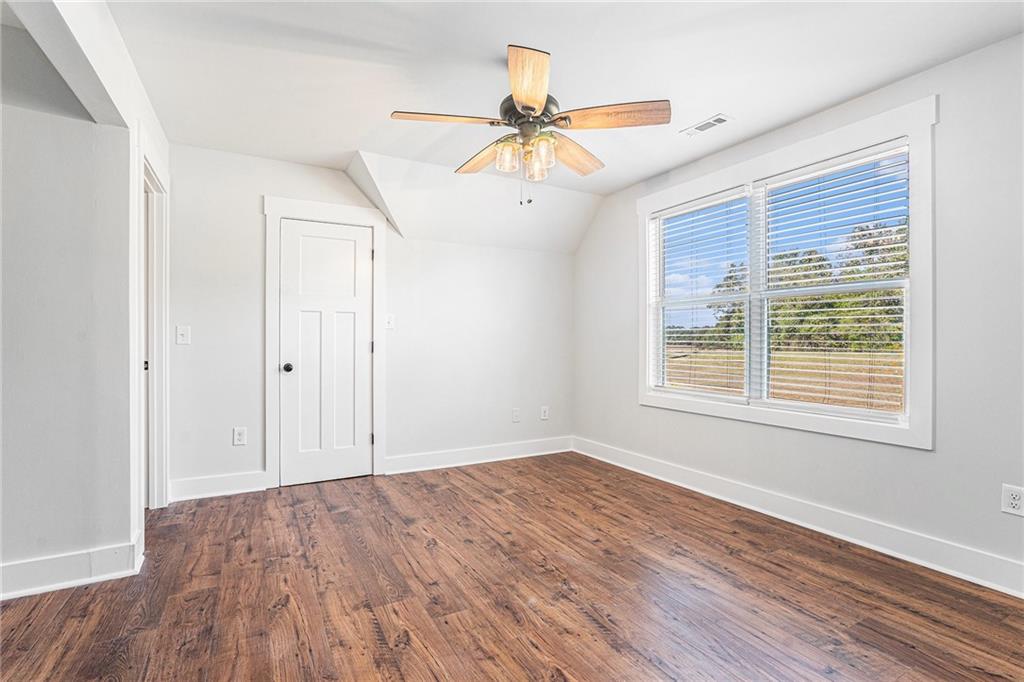 1550 Knox Chapel Road Social Circle, GA 30025 - Photo 30 of 35 wooden floor in an empty room with a window