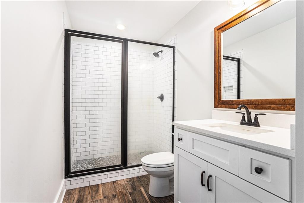 1550 Knox Chapel Road Social Circle, GA 30025 - Photo 31 of 35 a bathroom with a sink a toilet and shower