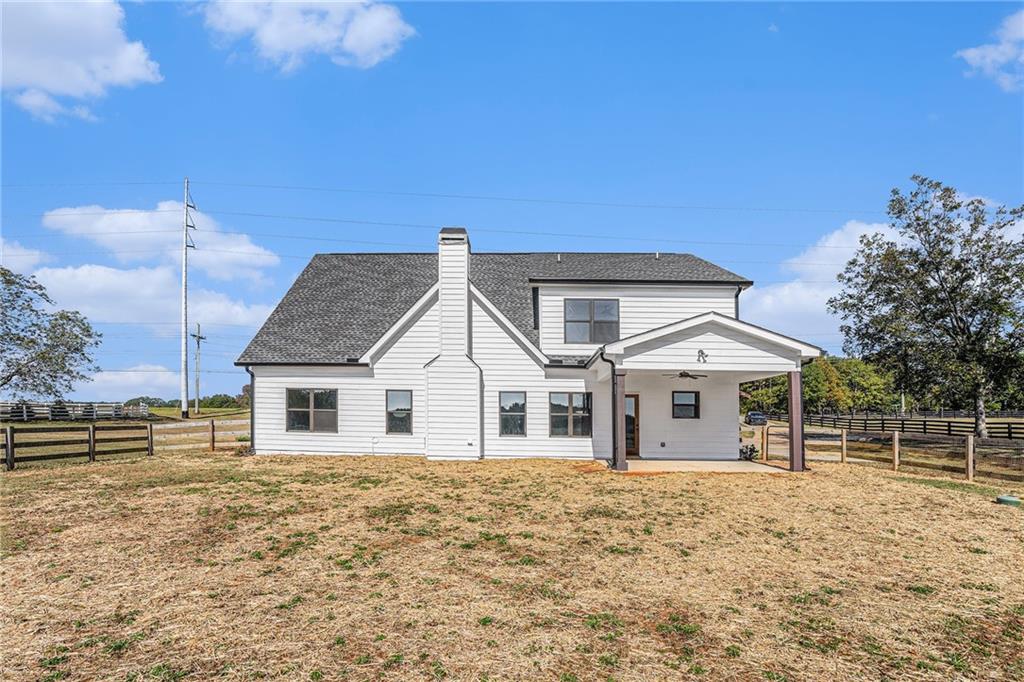 1550 Knox Chapel Road Social Circle, GA 30025 - Photo 34 of 35 a front view of a house with a garden