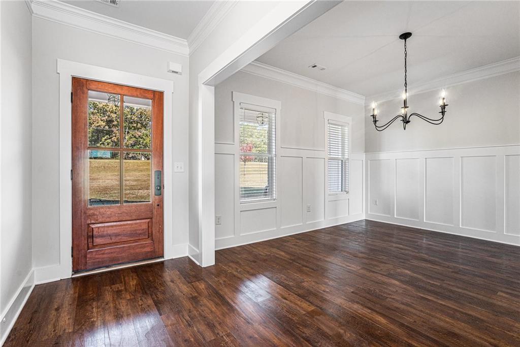 1550 Knox Chapel Road Social Circle, GA 30025 - Photo 4 of 35 a view of empty room with wooden floor and fan
