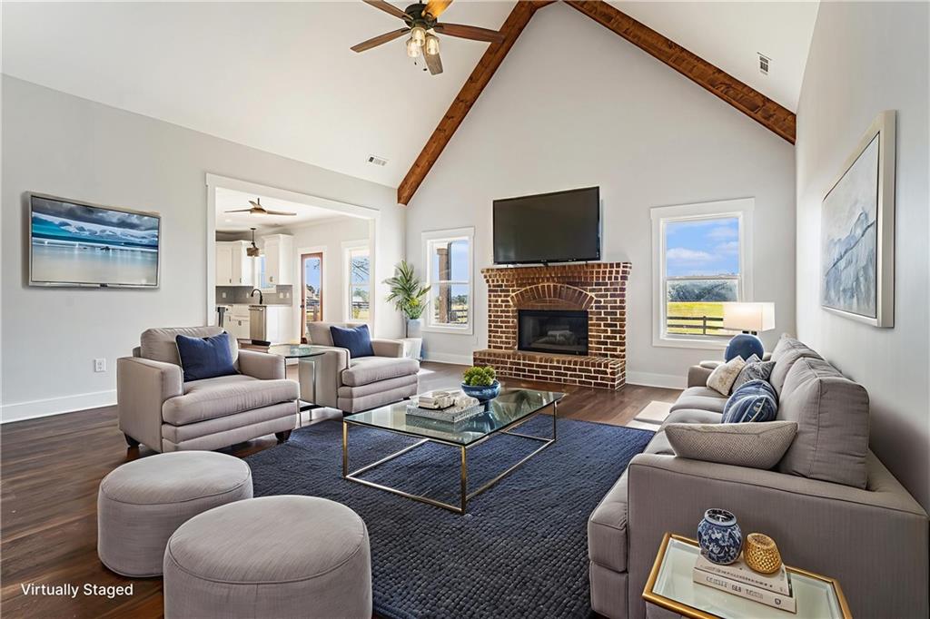 1550 Knox Chapel Road Social Circle, GA 30025 - Photo 6 of 35 a living room with furniture fireplace and a flat screen tv