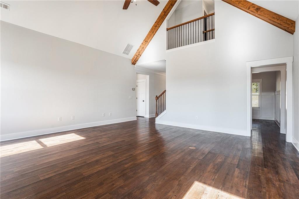 1550 Knox Chapel Road Social Circle, GA 30025 - Photo 8 of 35 a view of a hallway with wooden floor and staircase